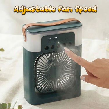 Portable fan with adjustable speed control and a hand touching it on a light background.